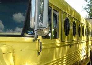 Mellow Yellow Party Bus exterior as seen from the front on the driver's side