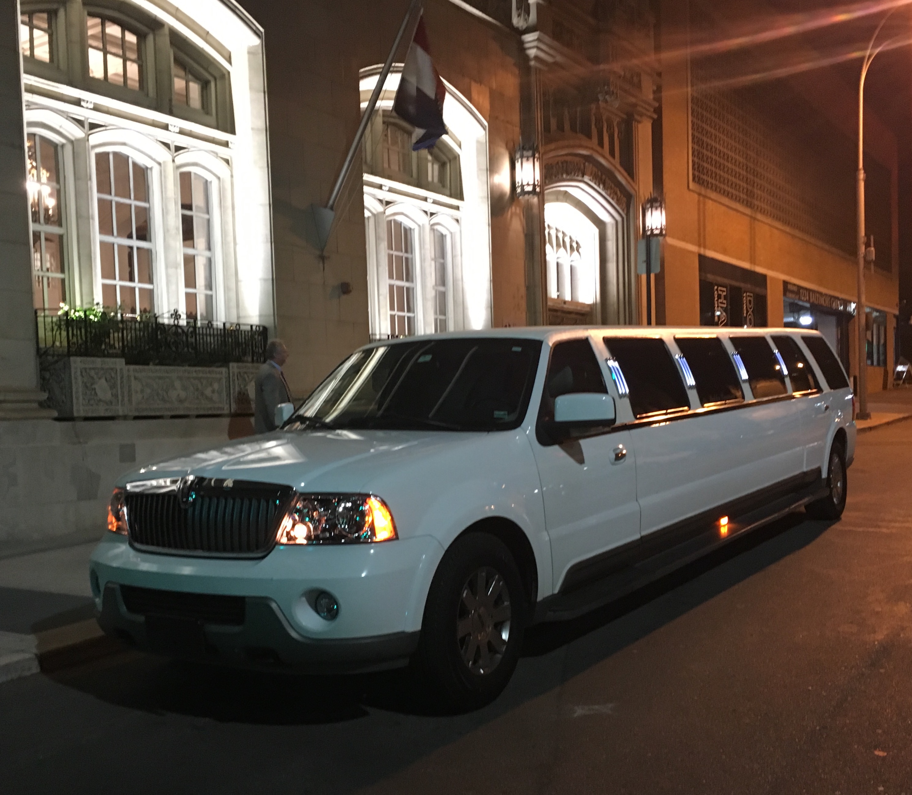 Outside the White SUV Limousine (View 1)