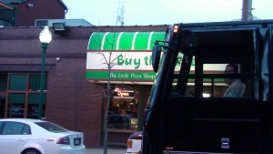 Black VIP Party Bus in front of Joe's Pizza in Westport
