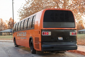 Orange Party Bus (Exterior, Rear, Driver’s Side)